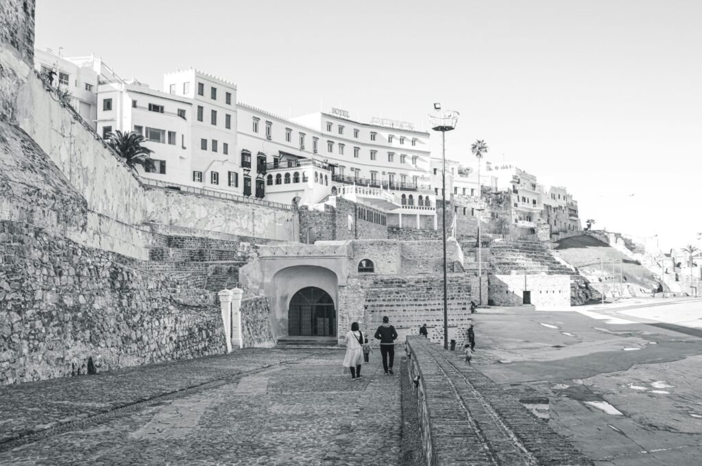 Monochrome view of people walking in historic Tangier, Morocco.