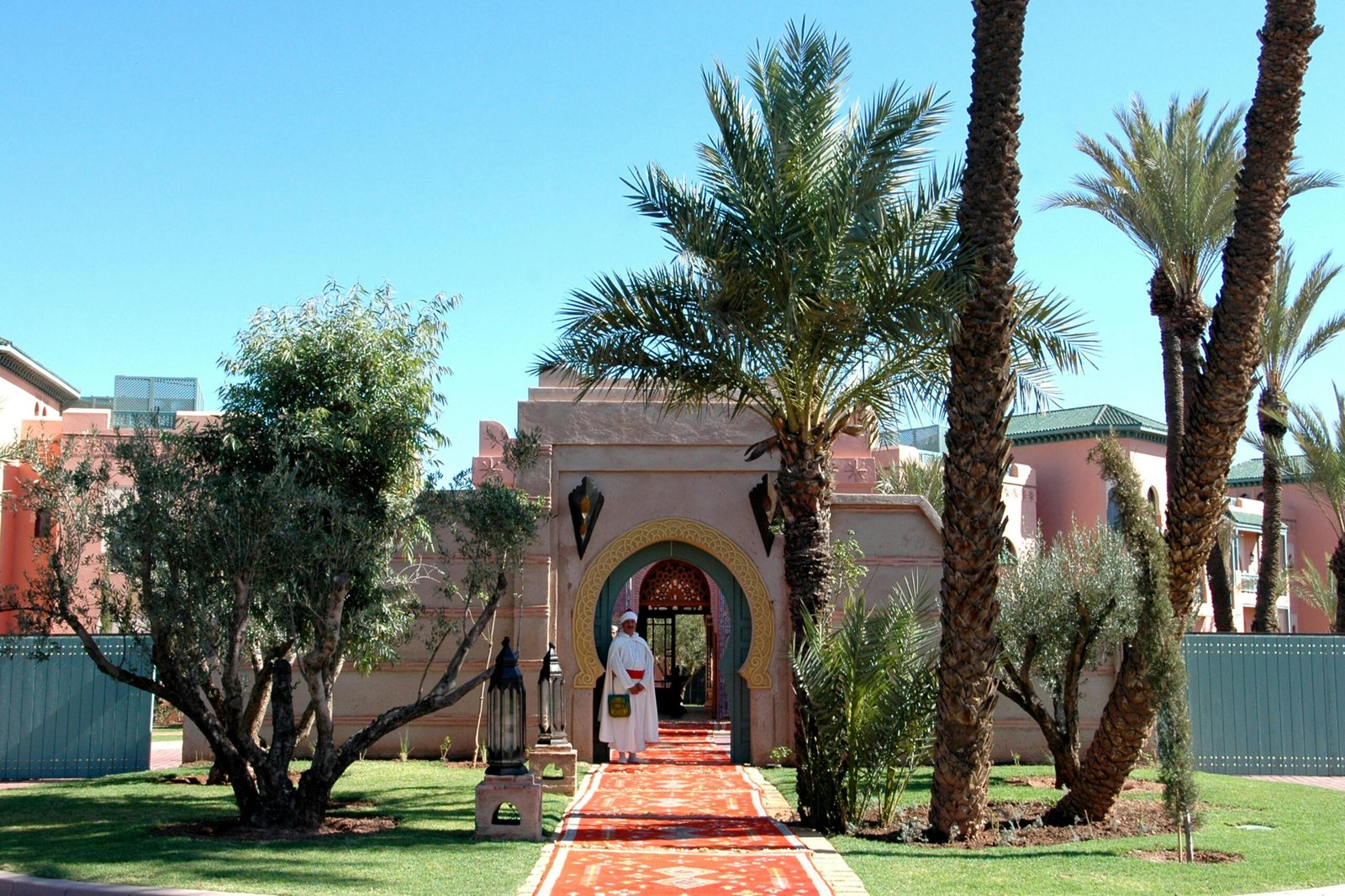 Explore traditional Moroccan architecture surrounded by lush gardens in Marrakech.