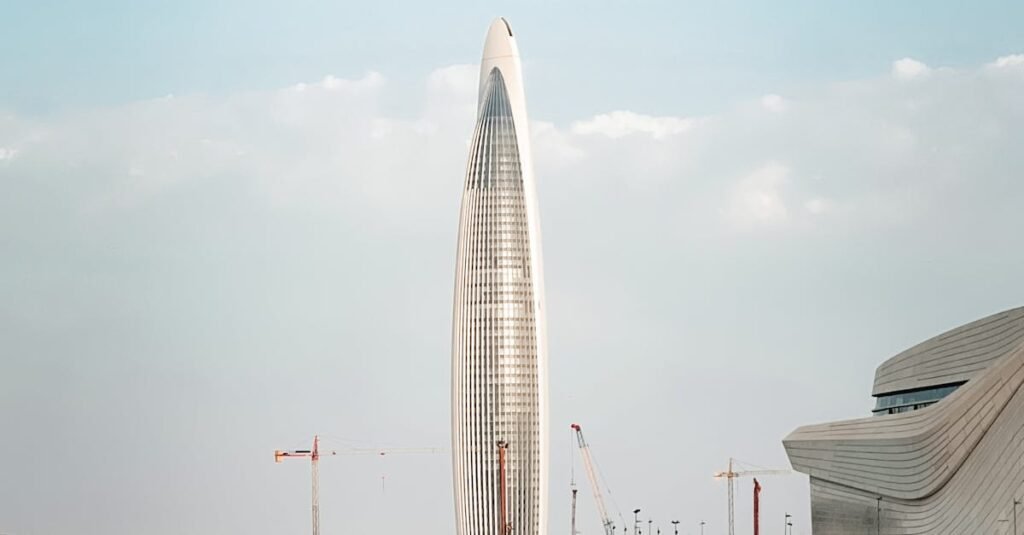 Stunning view of a modern tower by the waterfront in Rabat, Morocco with clear skies.